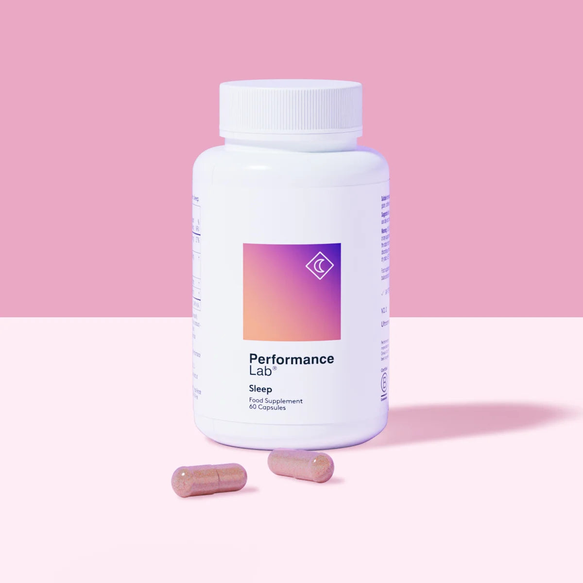 Performance Lab Sleep supplement bottle with two capsules.