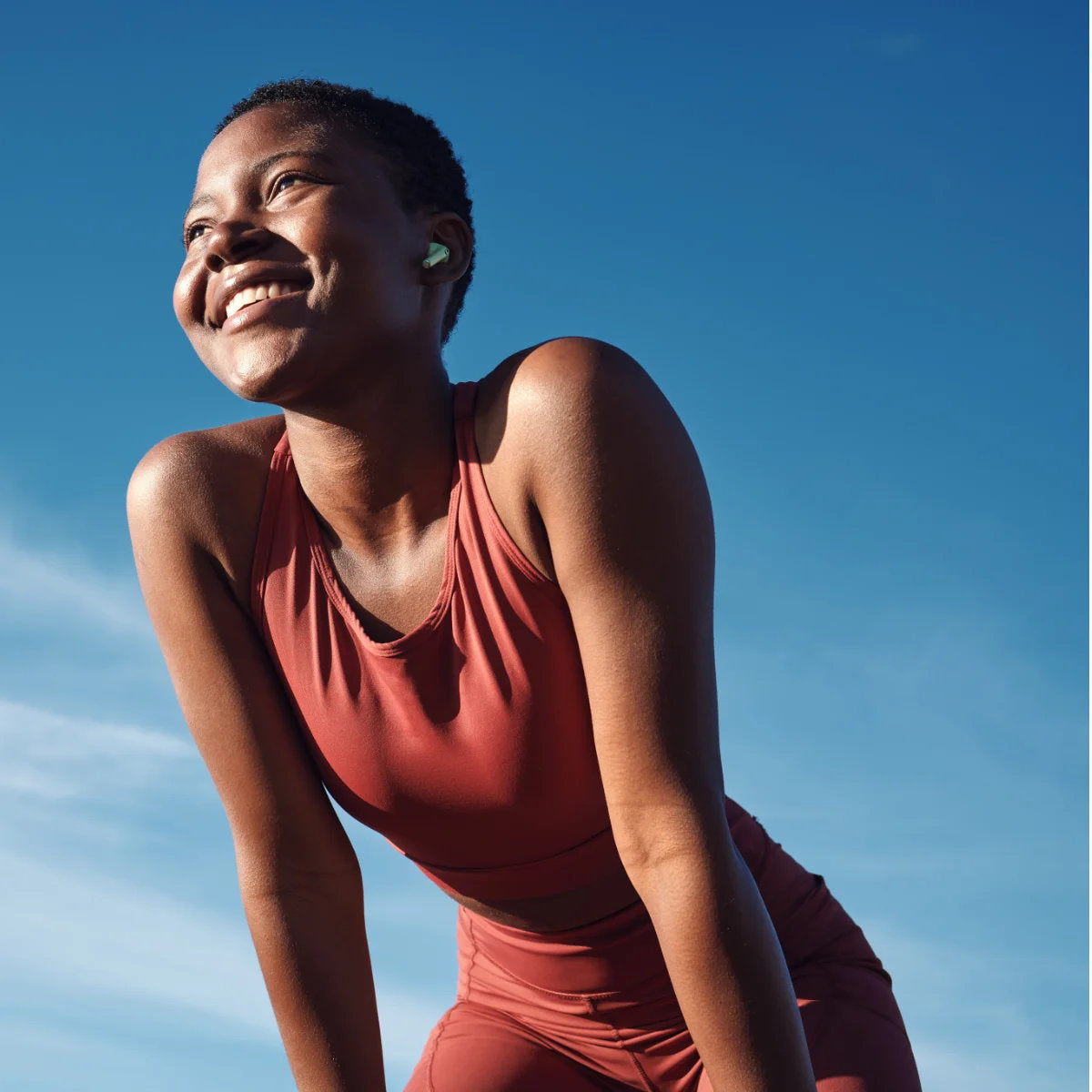 image of woman in gym gear smiling